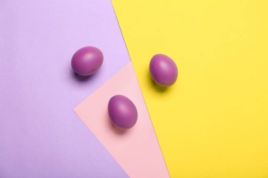Painted Easter eggs on colorful background