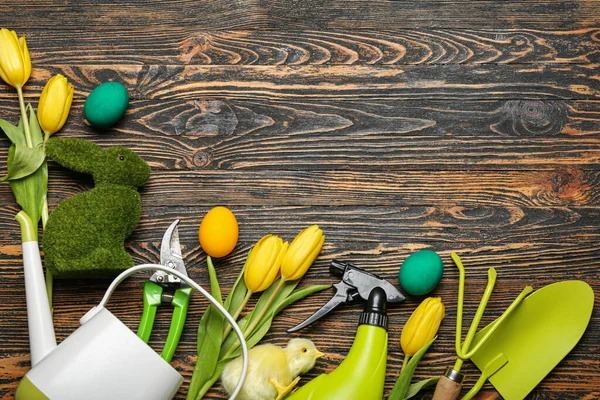 Gardener Tools Easter Eggs Rabbit Chicken Tulips Dark Wooden Background — Stock Photo, Image