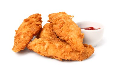Delicious nuggets and bowl of sauce on white background