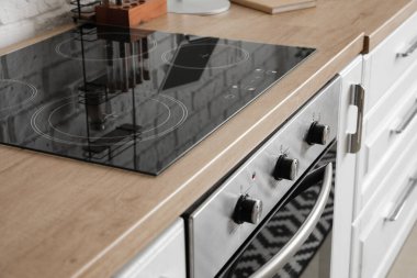 Electric stove and oven in modern kitchen, closeup