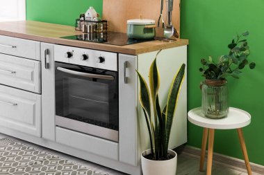 Modern electric oven with stove in interior of kitchen