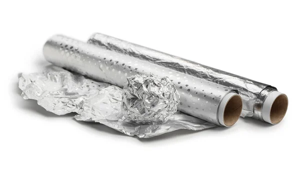 Rolls and ball of aluminium foil on white background