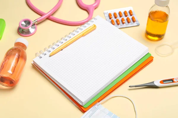 Blank Notebook Medical Supplies Yellow Background Closeup World Health Day — Foto Stock