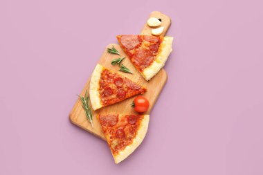 Board with slices of delicious pepperoni pizza, tomato and rosemary on lilac background