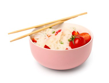Bowl of tasty rice noodles with vegetables on white background