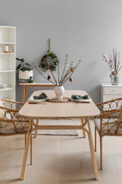 Beautiful dinnerware on wooden table served for Easter celebration