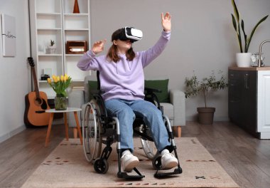 Young woman in wheelchair using VR glasses at home