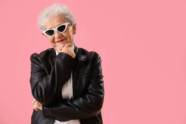 Thoughtful Senior Woman Sunglasses Pink Background — 스톡 사진
