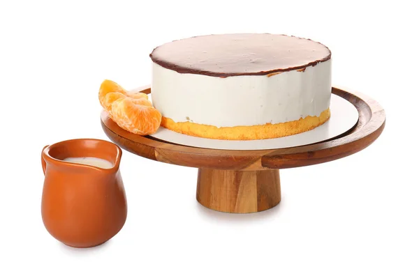 Dessert stand with tasty birds milk cake on white background