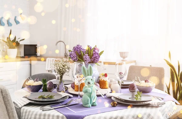 Festive table setting for Easter celebration in kitchen