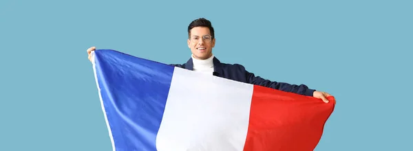 Knappe Jongeman Met Vlag Van Frankrijk Lichtblauwe Achtergrond — Stockfoto