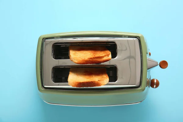 Modern Toaster Crispy Bread Slices Blue Background — Stock Photo, Image