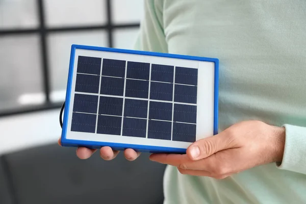 Young Man Portable Solar Panel Home Closeup — Stock fotografie