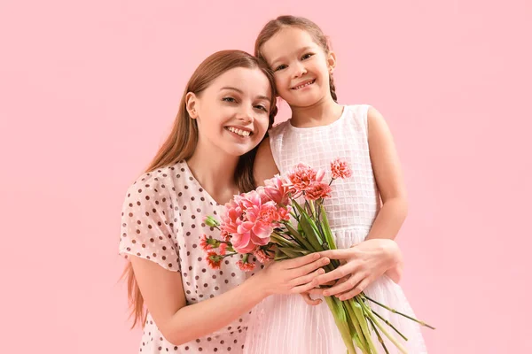 Cute Little Girl Her Mother Flowers Hugging Pink Background — Stock Photo, Image