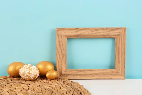 Blank Frame Easter Eggs Table Blue Wall — Stock Photo, Image