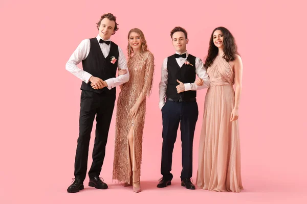 Beautiful Couples Dressed Prom Pink Background — 스톡 사진