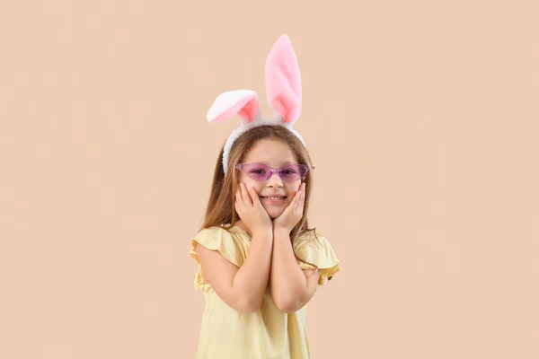 Cute Little Girl Bunny Ears Beige Background – stockfoto