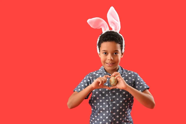 African American Little Boy Bunny Ears Easter Egg Red Background — Stockfoto