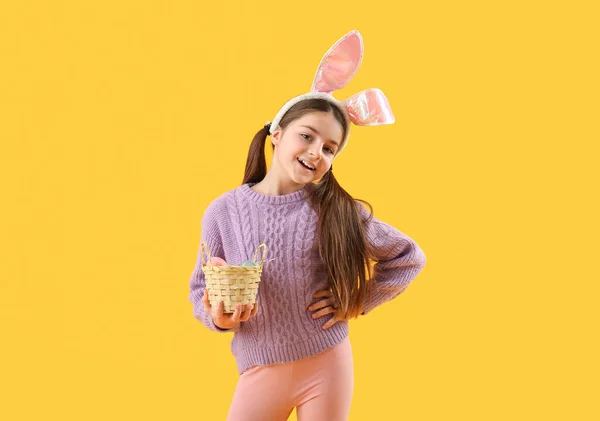 Little Girl Bunny Ears Basket Easter Eggs Yellow Background — Stock Fotó