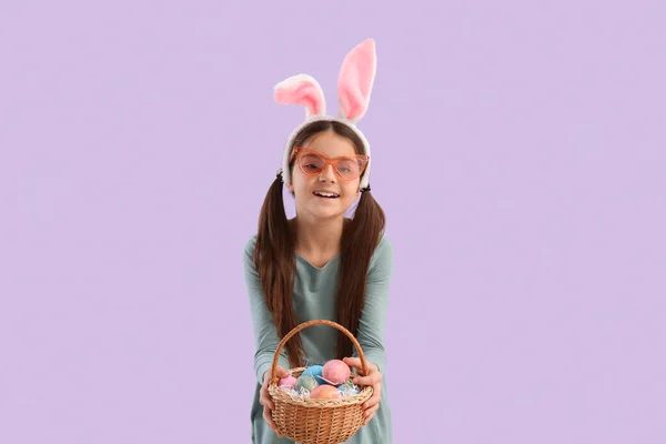 Little Girl Bunny Ears Basket Easter Eggs Lilac Background — Fotografia de Stock