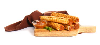 Board with delicious wafer rolls, boiled condensed milk and mint isolated on white background