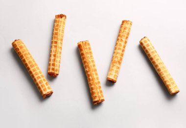 Delicious wafer rolls with boiled condensed milk isolated on white background