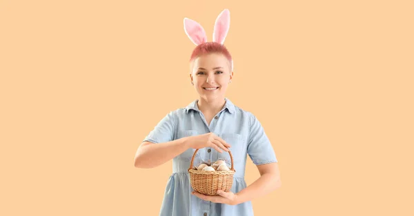 Young Woman Bunny Ears Basket Easter Eggs Beige Background — Φωτογραφία Αρχείου