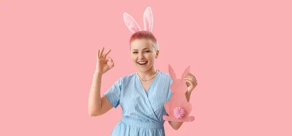 Happy Young Woman Paper Easter Rabbit Showing Gesture Pink Background — Stok fotoğraf