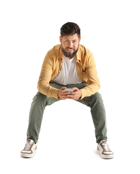 Young Bearded Man Mobile Phone Sitting Chair White Background — Photo