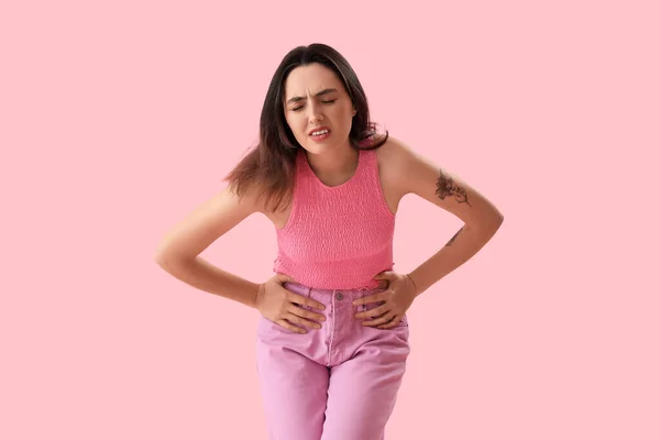 Young Woman Suffering Menstrual Cramps Pink Background — Zdjęcie stockowe