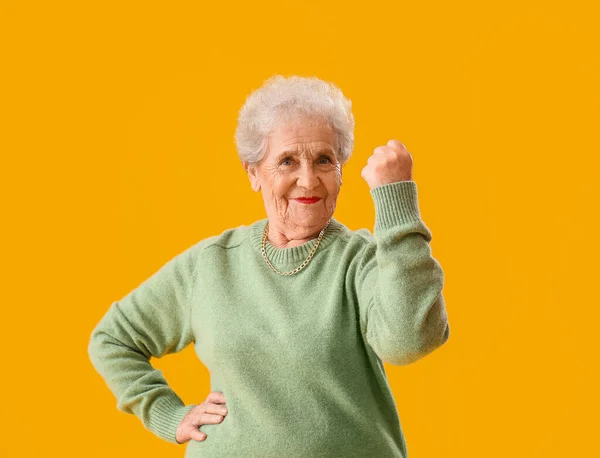 Happy Senior Woman Green Sweater Yellow Background — Fotografia de Stock