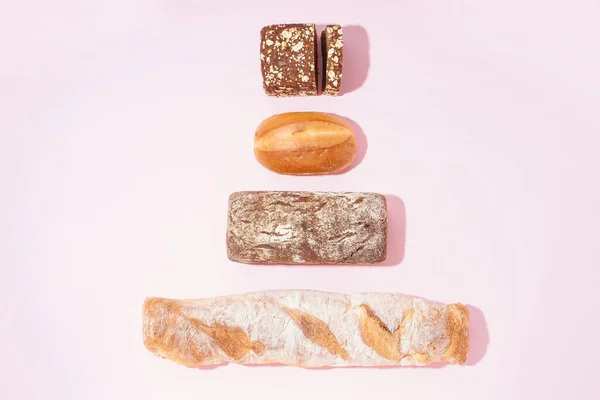 Fresh Loaves Different Bread Pink Background — Stok fotoğraf