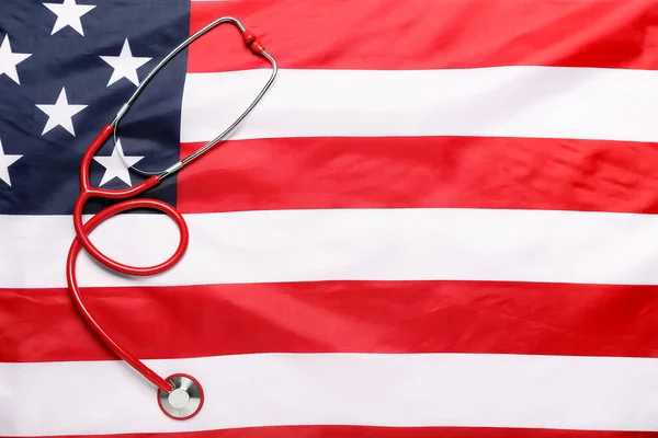 stock image Stethoscope on USA flag, top view