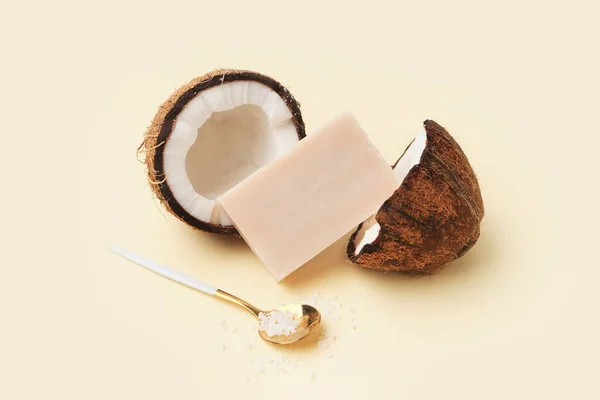 Natural soap bar, coconut and sea salt on color background