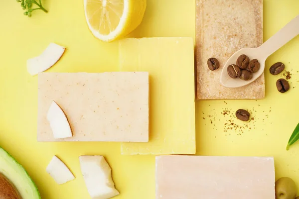 stock image Composition with soap bars and natural ingredients on yellow background