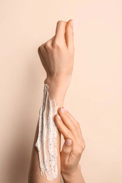 Woman Applying Scrub Her Hand Color Background Closeup — Stok fotoğraf