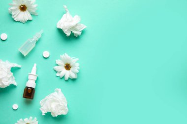 Bottles of drops with pills, flowers and tissues on color background. Seasonal allergy concept