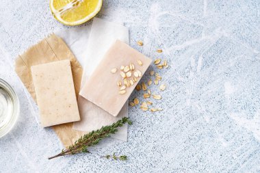 Composition with soap and natural ingredients on light background