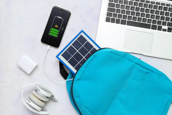 Composition Portable Solar Panel Charging Mobile Phone White Grunge Background — Stock Photo, Image