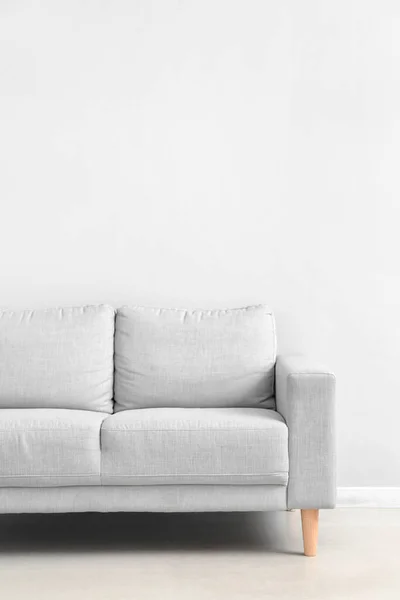 Stylish Grey Sofa White Wall — Φωτογραφία Αρχείου