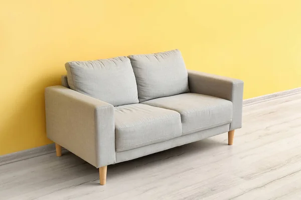 Stylish Grey Sofa Yellow Wall — Stok fotoğraf