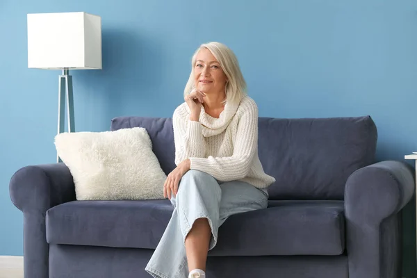 Mature Woman Sitting Blue Sofa Home — Stock Photo, Image