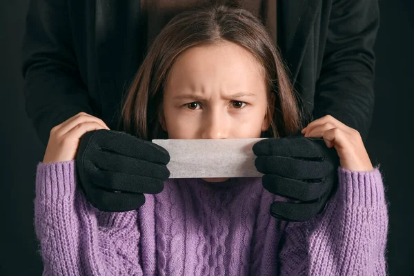Terrorist Taping Mouth Little Hostage Black Background — Stock Photo, Image