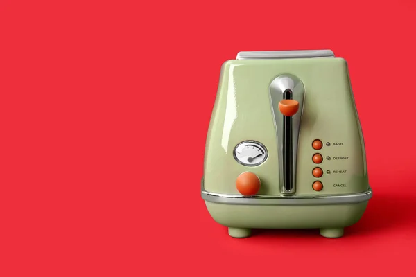 stock image Modern toaster on red background