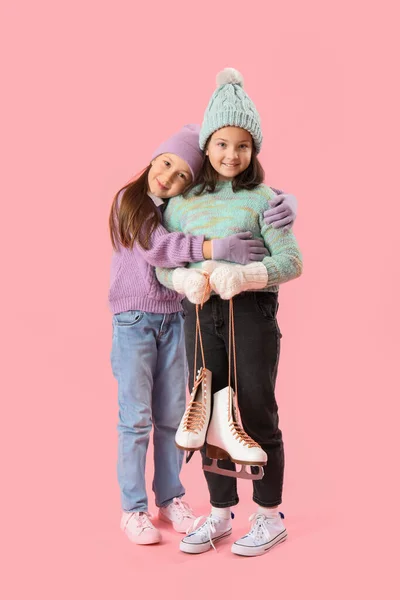 Little Girls Winter Clothes Ice Skates Hugging Pink Background — Stock Photo, Image
