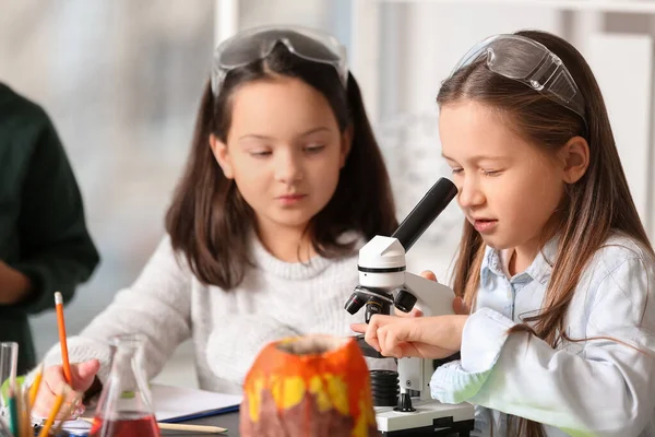 stock image Cute little children with microscope in science classroom