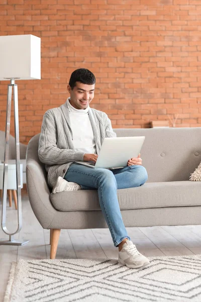 Young Man Using Laptop Grey Sofa Home — Stock Photo, Image