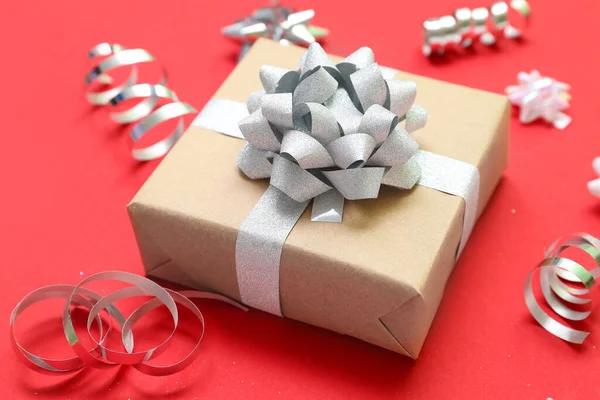 Gift Box Bow Serpentine Red Background Closeup — Stock Photo, Image