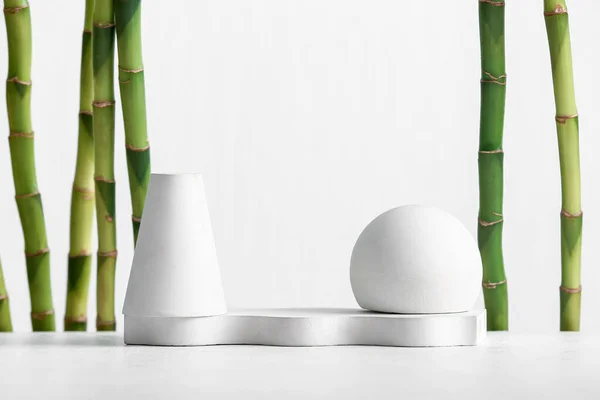 Green Bamboo Stems Plaster Podiums White Background —  Fotos de Stock