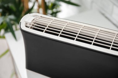 Air purifier on table in room, closeup